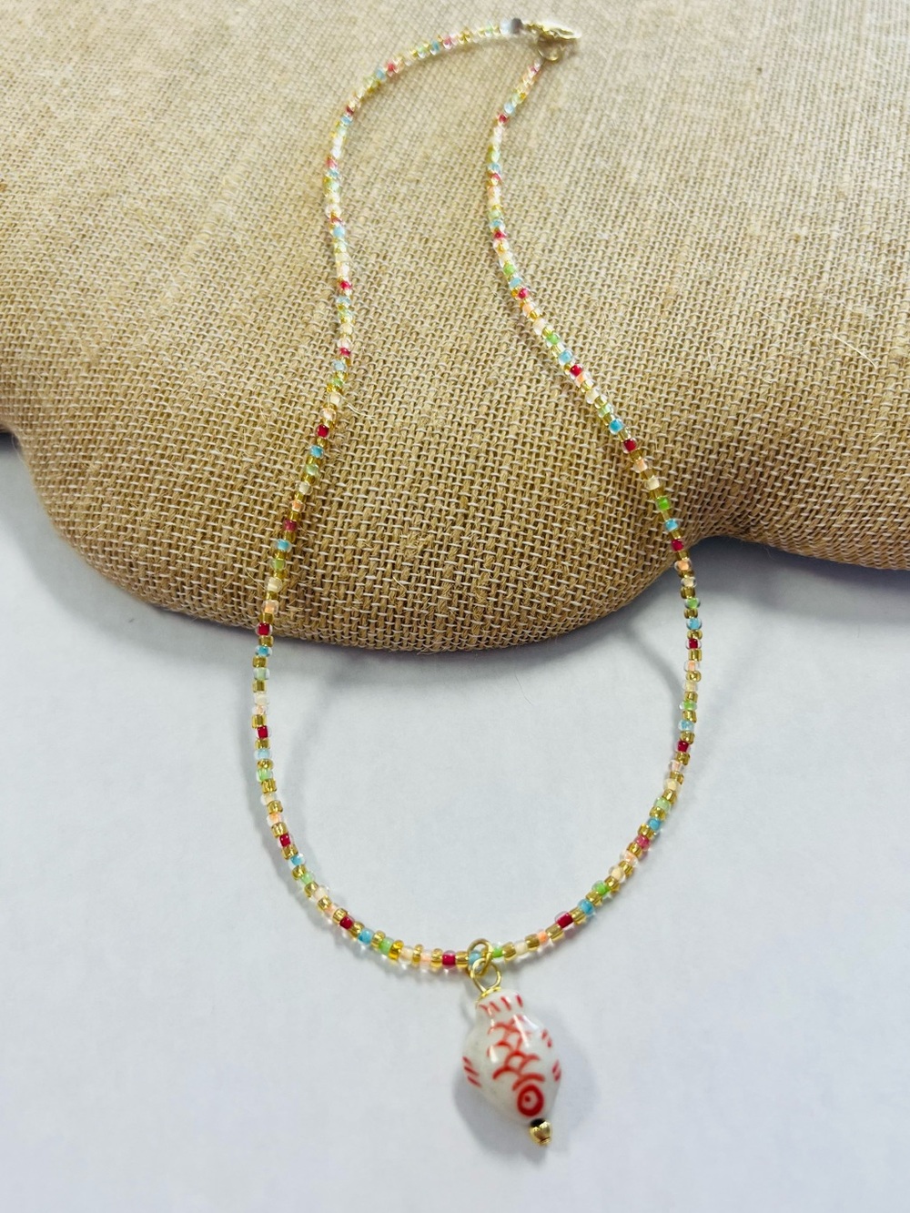 Hand Crafted Multicolor Seed Bead Necklace with White Red Ceramic Pendant